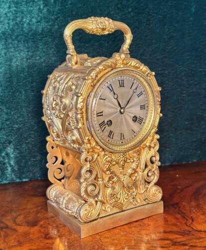 Carriage Clock In A Cast Gilt Case