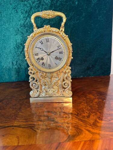 Carriage Clock In A Cast Gilt Case