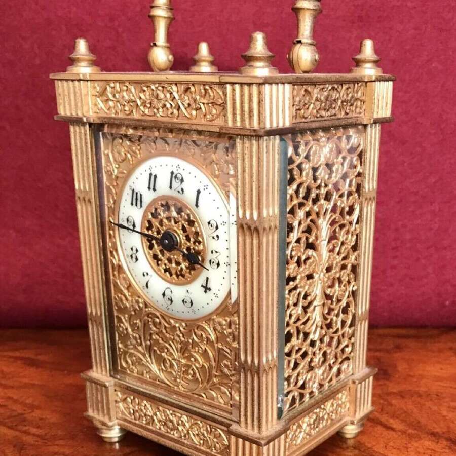 Carriage Clock With Filigree Mask And Side Panels Circa 1900