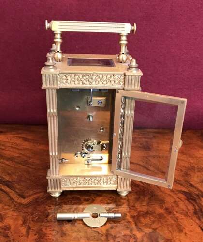 Carriage Clock With Filigree Mask And Side Panels Circa 1900