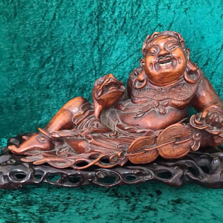 An Amusing Reclining Figure Of A Corpulent Buddha. Chinese. Sculpture. Circa 1900