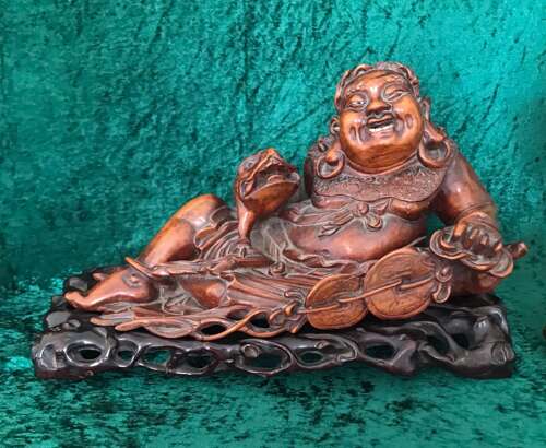An Amusing Reclining Figure Of A Corpulent Buddha. Chinese. Sculpture. Circa 1900