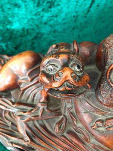 An Amusing Reclining Figure Of A Corpulent Buddha. Chinese. Sculpture. Circa 1900